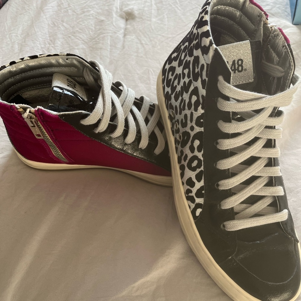 Black and White High-Top Sneakers with Unique Design and Clean White Sole